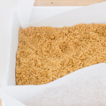 graham cracker crust ingredients mixed together.