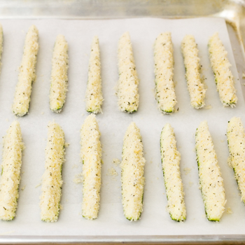 coated zucchini on sheet