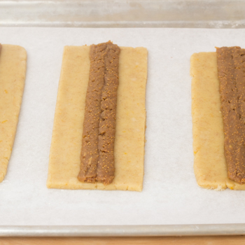 Filing piped into the centre of each rectangular dough piece.