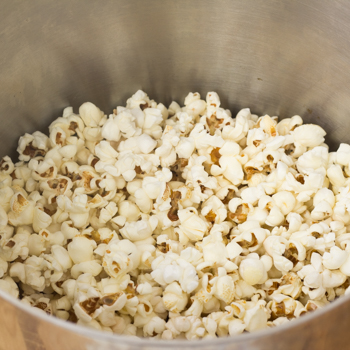 Popcorn popped in the big pot.