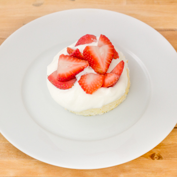 sponge cake with strawberries and cream in the centre.