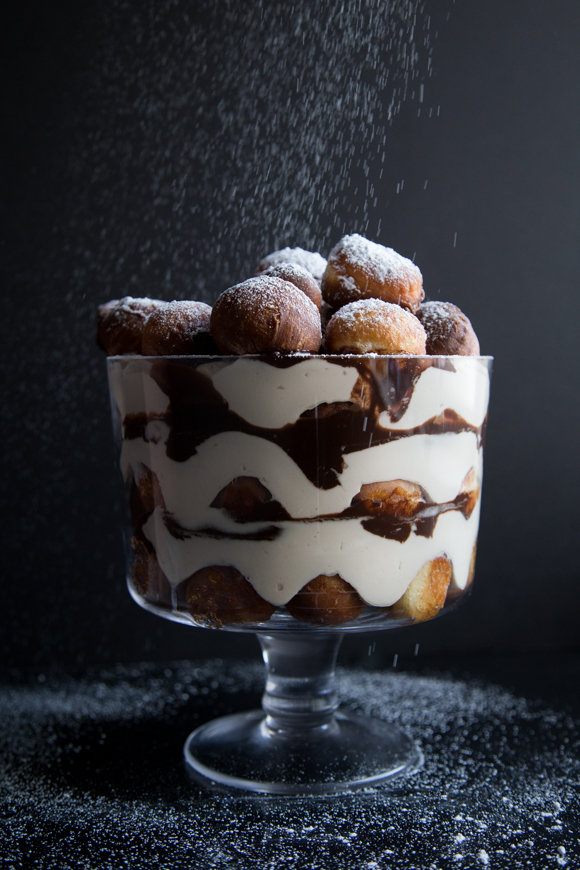 Tiramisu beignets finished with icing sugar.