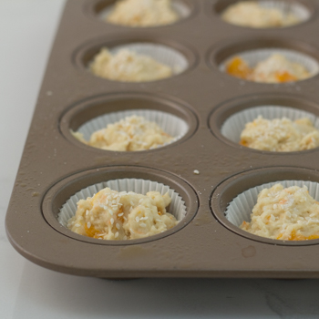 Muffin tins filled with dough
