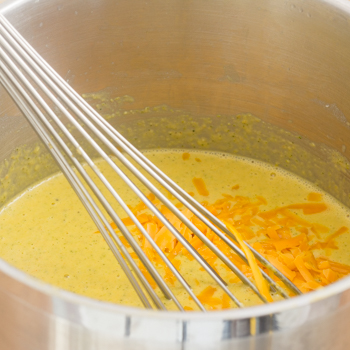 melting cheese into soup