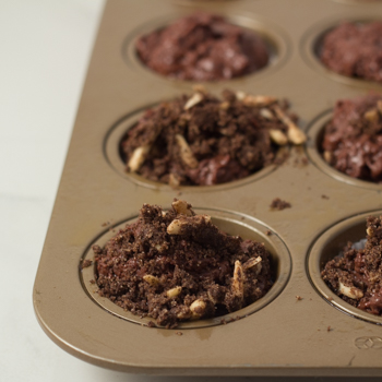 Batter divided amongst muffin cups