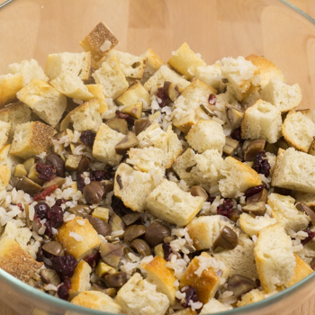 cubed bread with various ingredients in bowl