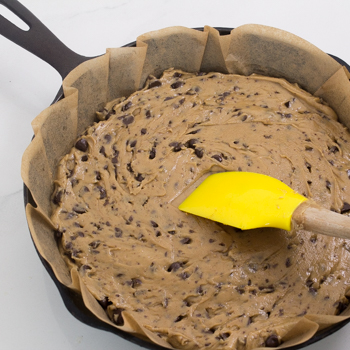 adding dough to skillet